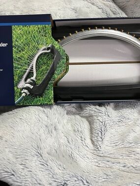 Oscillating Lawn Sprinkler in Black and Silver - Reliable Garden Watering